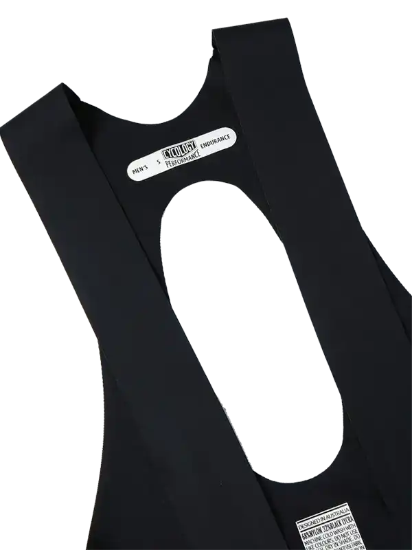 Men's black cycling bib shorts with performance endurance label, designed in Australia