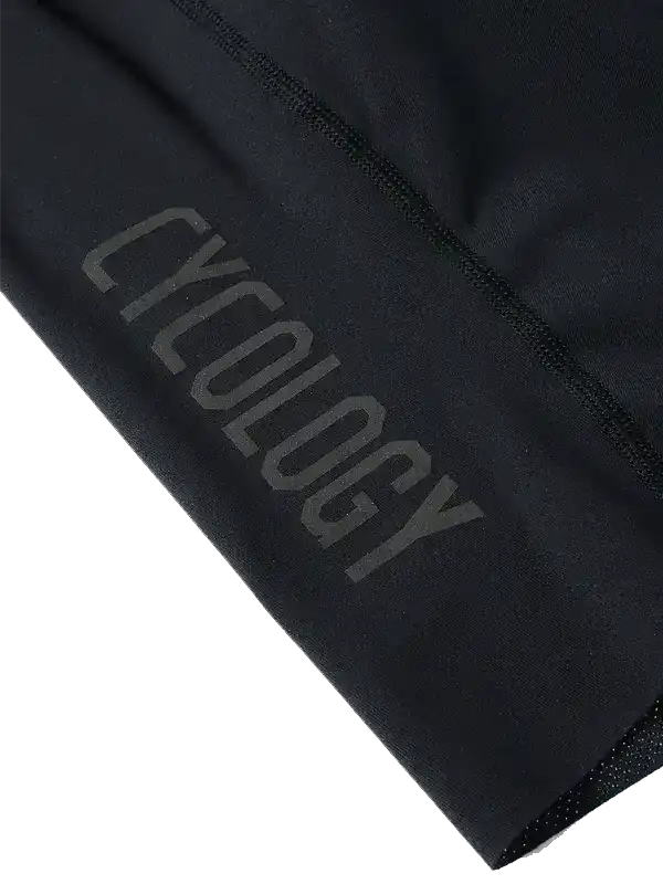 Black cycling shorts with 'CYCOLOGY' logo, high-quality fabric for men's and women's bike wear