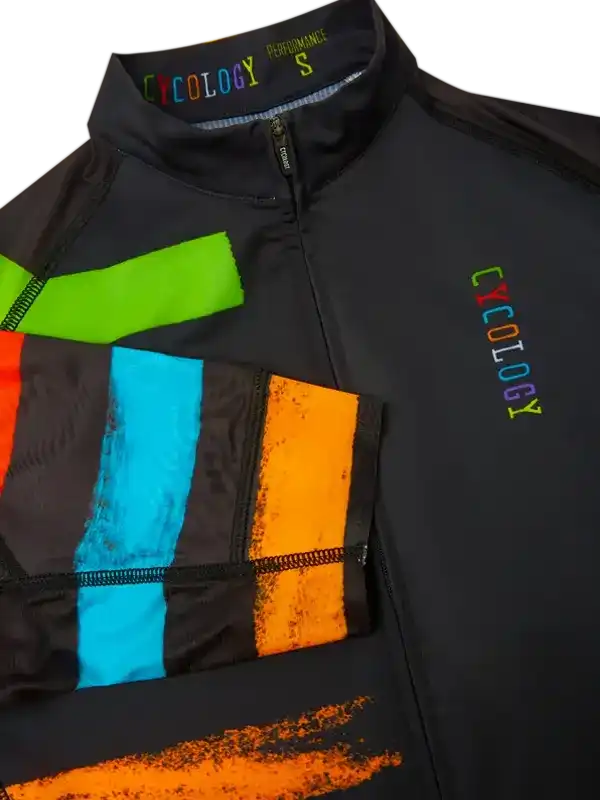 Black cycling jersey with vibrant rainbow panels and Cycology logo, designed for performance and style.