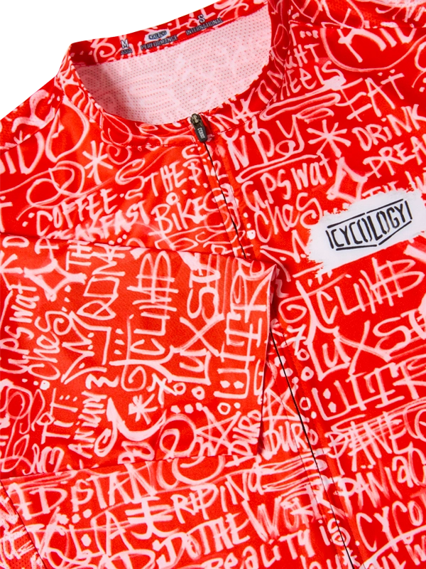 Red cycling jersey with white text pattern and Cycology logo