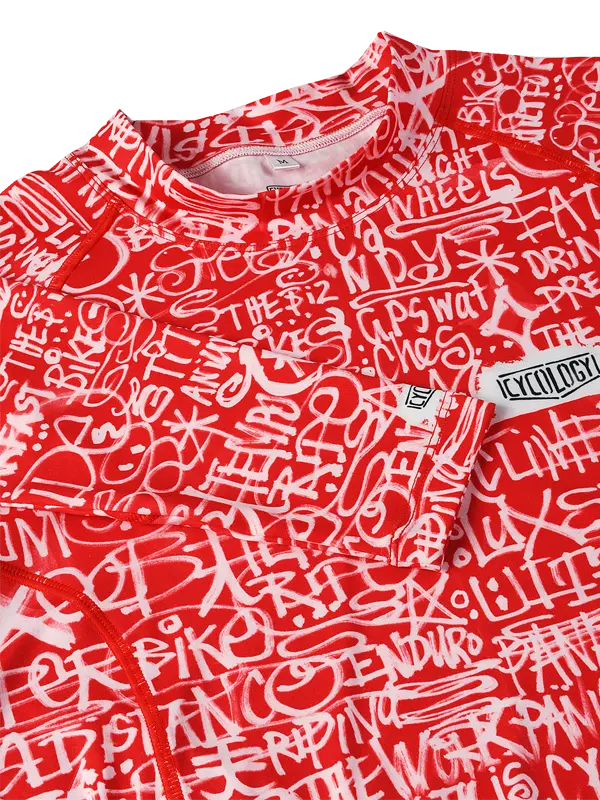 Red long-sleeve cycling base layer with white text and graphics 