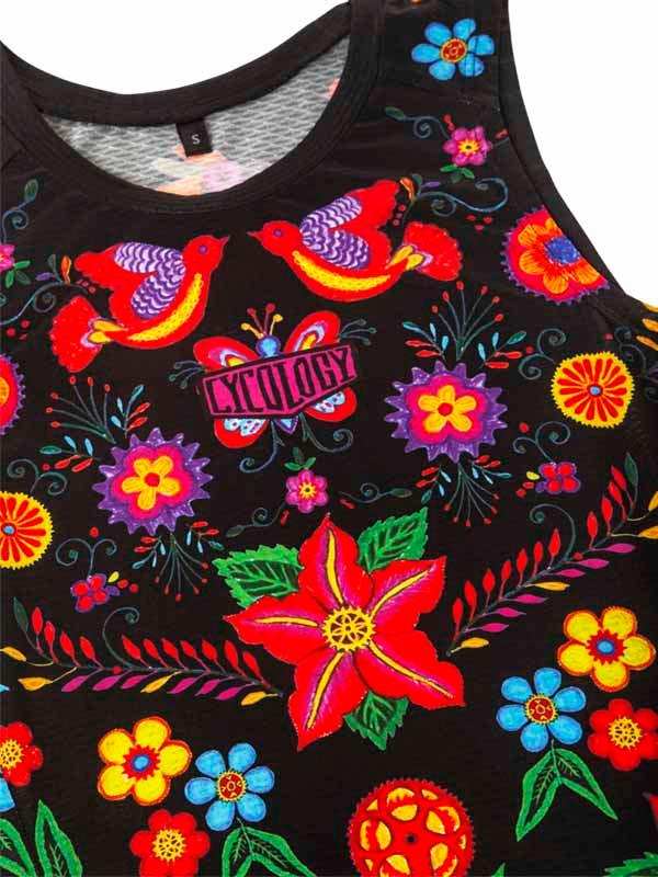 Black cycling tank top with vibrant floral and bird print, featuring colorful embroidery and bold patterns.