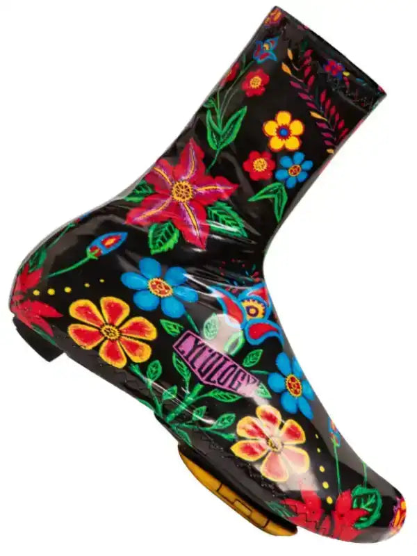 Black cycling shoe cover with vibrant floral print for wet weather rides