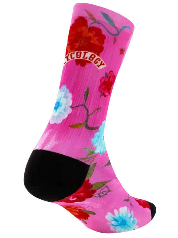 Pink floral cycling sock with black toe and heel, featuring vibrant red and blue flowers for women's bike rides