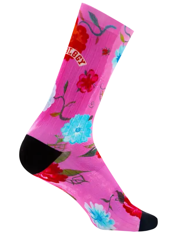 Pink floral cycling socks with black toe and heel, vibrant red and blue flowers on bright background