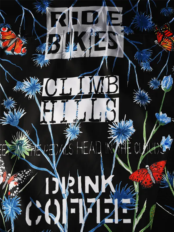 Motivational text 'Ride bikes, Climb hills, Drink coffee' with floral and butterfly design on a black background.