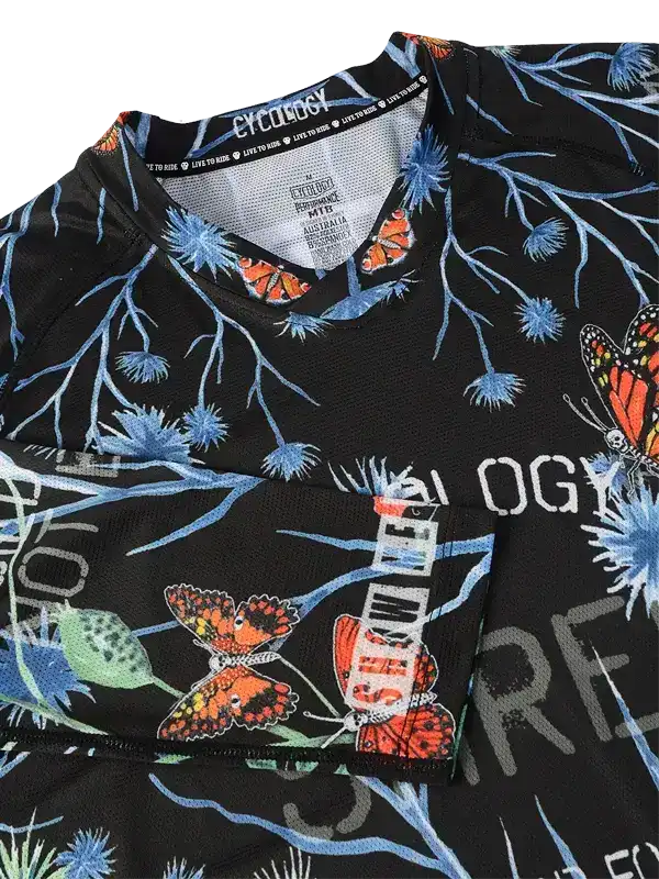 Black cycling jersey with butterfly and floral print, ideal for men's and women's rides