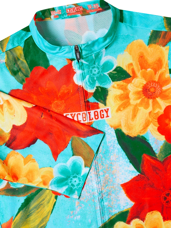 Colorful floral-patterned cycling jersey  collar on a turquoise background