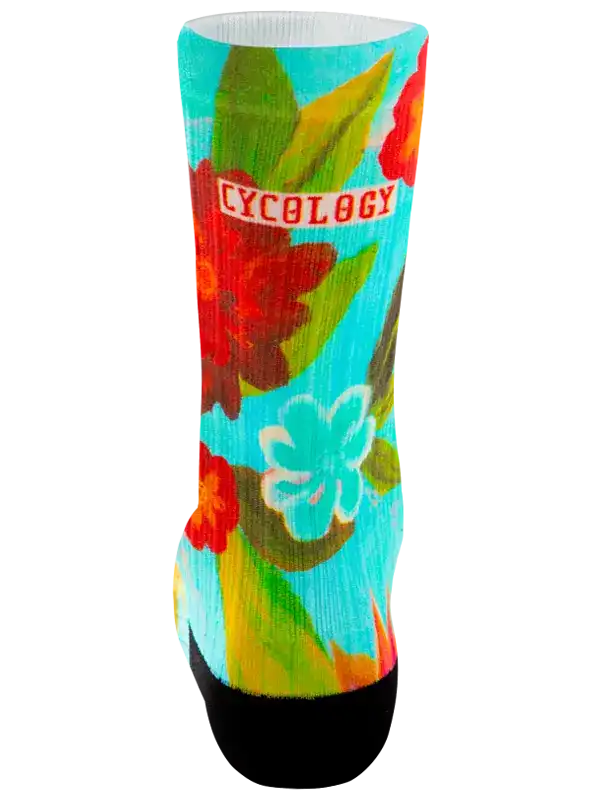 Cycology floral cycling sock with vibrant tropical print and black toe, designed for comfort and style on rides.