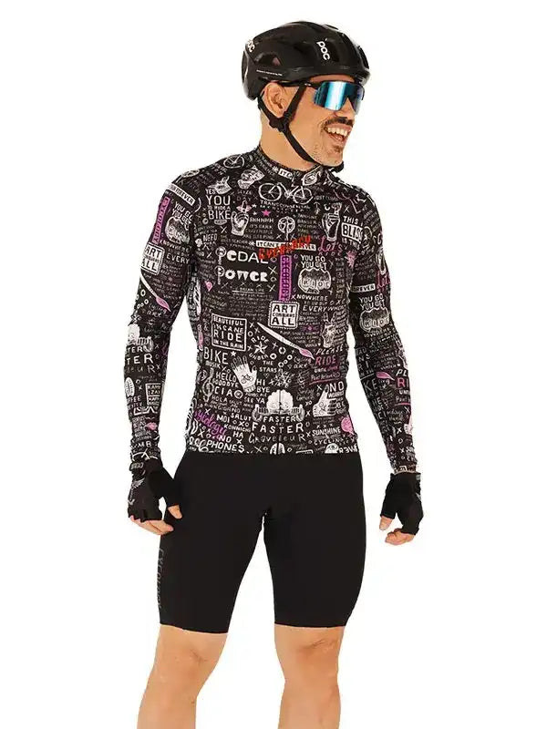 Man in black cycling jersey with colorful graphic print, helmet, and sunglasses, ready for a ride.