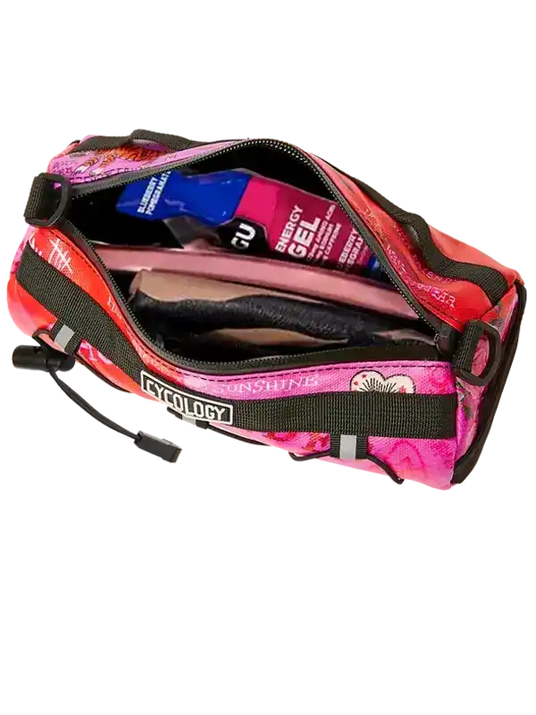 Pink and red cycling saddle bag with energy gels and tools, featuring Cycology branding