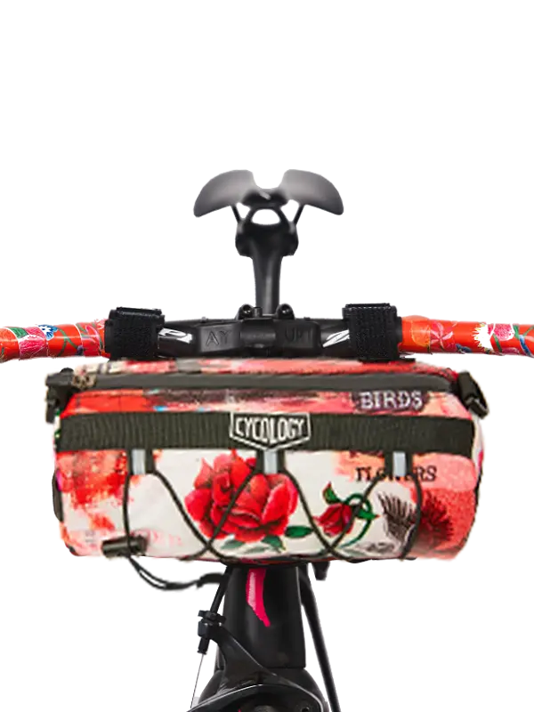 Floral and bird patterned bike bag with 'Cycology' branding