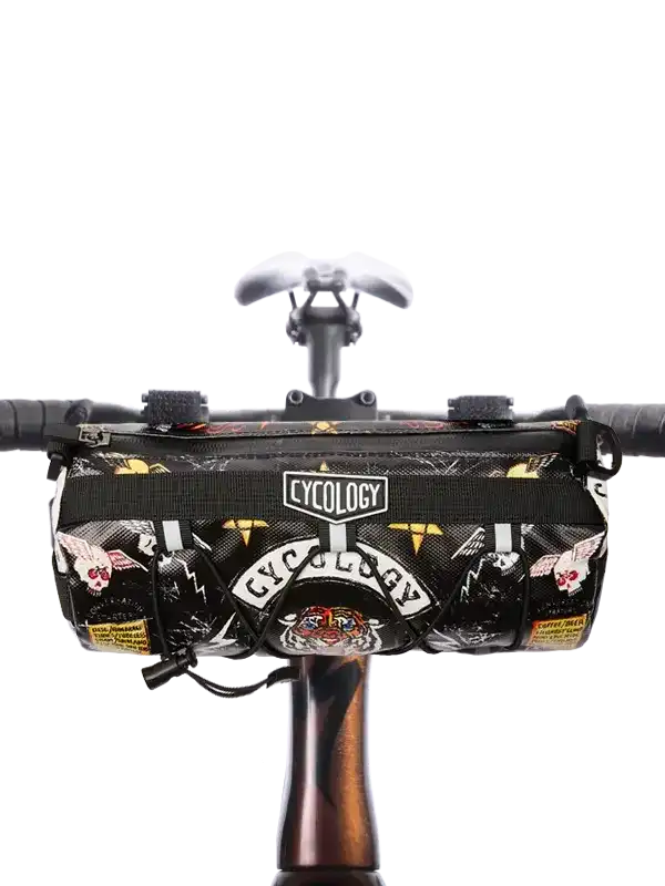 Cycology bike frame bag with bold skull and tiger print, mounted on handlebars for cycling gear storage