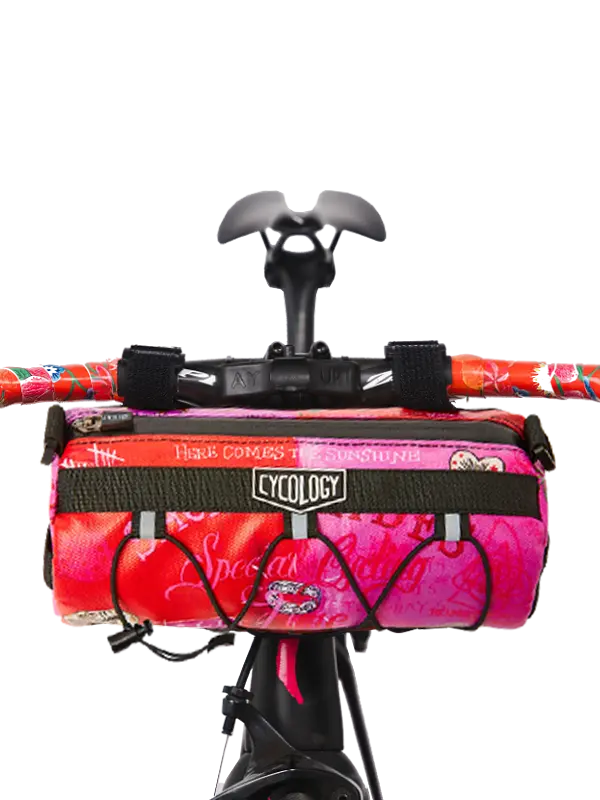 Bicycle handlebar bag with a pink and red design 