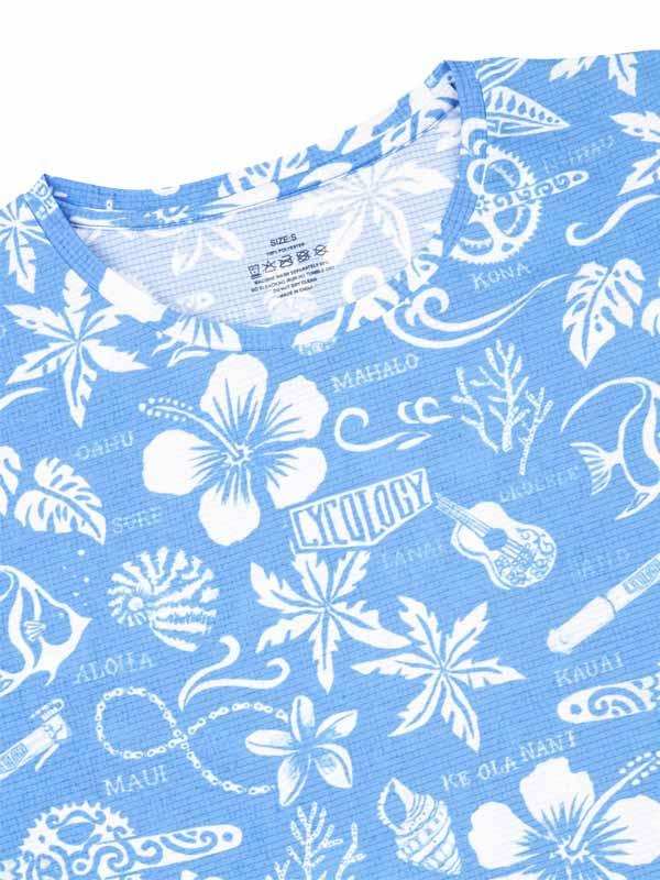 Blue Hawaiian-themed cycling jersey with white floral and island graphics, ideal for tropical rides.