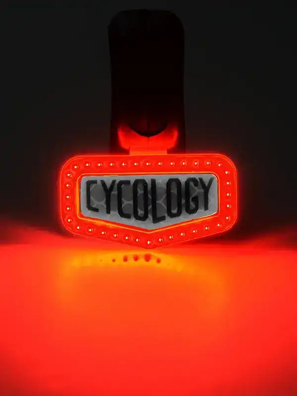 Cycology rear bike light with red LED glow and bold branding for night cycling safety