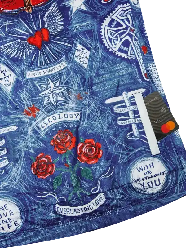 Blue cycling shorts with red roses, hearts, and 'Cycology Sydney' print, featuring unique tattoo-style design.