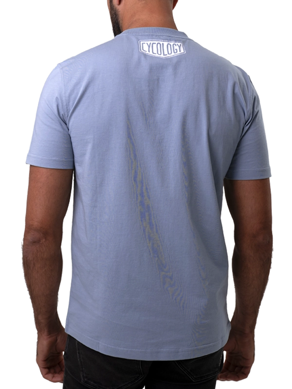 Light blue t-shirt with 'Cycology' branding on the back, worn by a person.