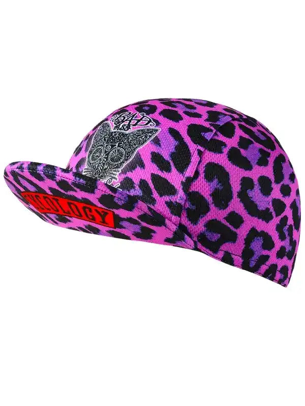 Pink leopard print cycling cap with skull design and red logo, ideal for bike rides and outdoor adventures.