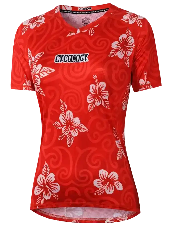 Red women's cycling jersey with white hibiscus flowers and swirl pattern, featuring Cycology logo