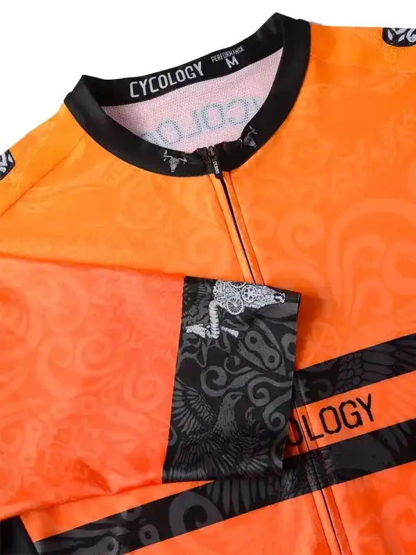 Vibrant orange cycling jersey with black swirl patterns and graphic sleeve design, featuring full zip and performance fit.