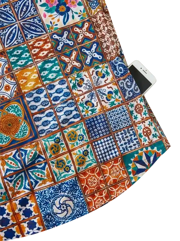 Colorful patchwork cycling jersey with tile-inspired patterns and phone pocket