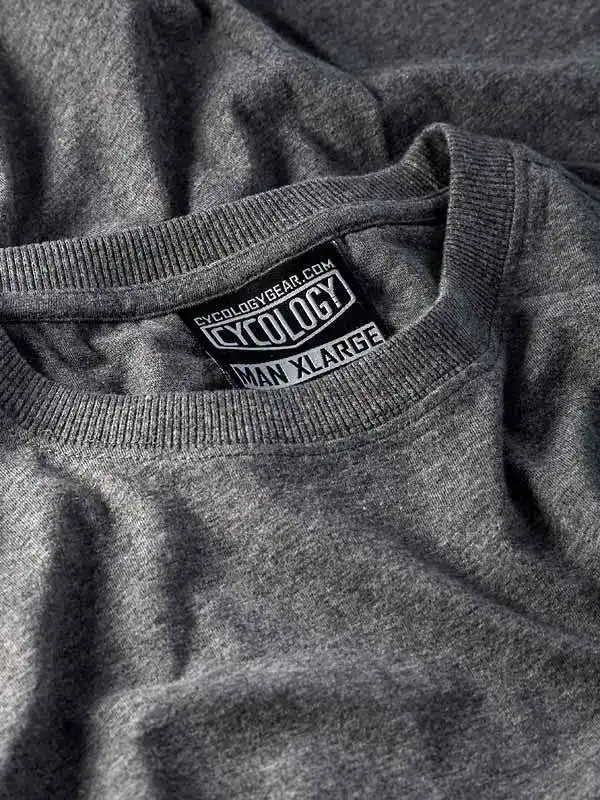 Grey men's cycling t-shirt with Cycology brand tag, size XL, soft fabric detail