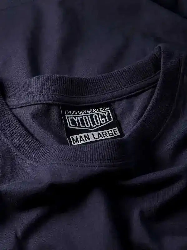 Dark navy men's cycling t-shirt with Cycology brand tag, size large, soft fabric detail