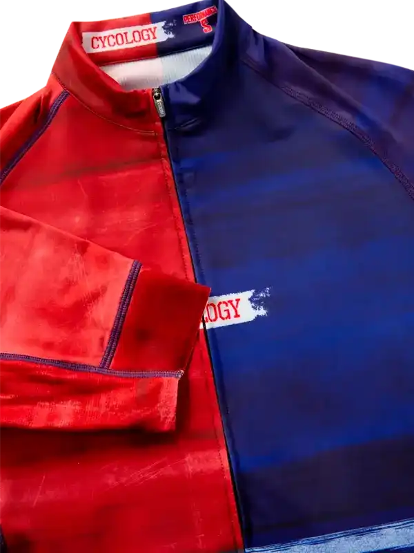 Red and blue cycling jersey with half-zip, featuring bold color block design and brand logo detail