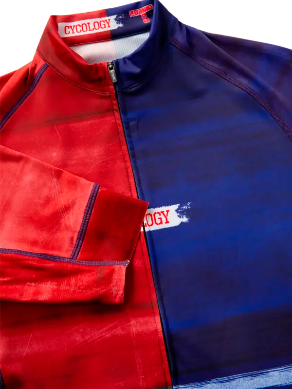 Red and blue cycling jersey with 'Cycology' branding.