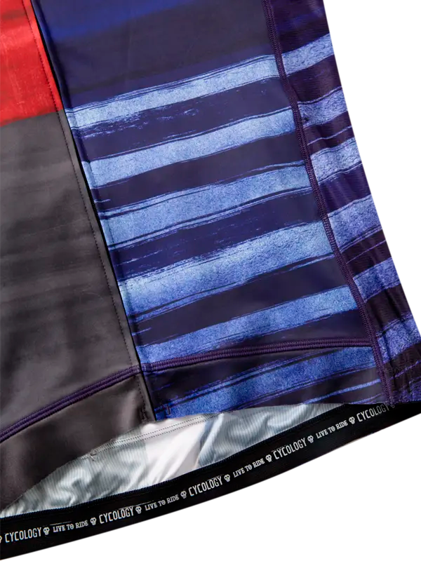 Close-up of a folded fabric with blue and black striped pattern, featuring the brand 'Cycology'.