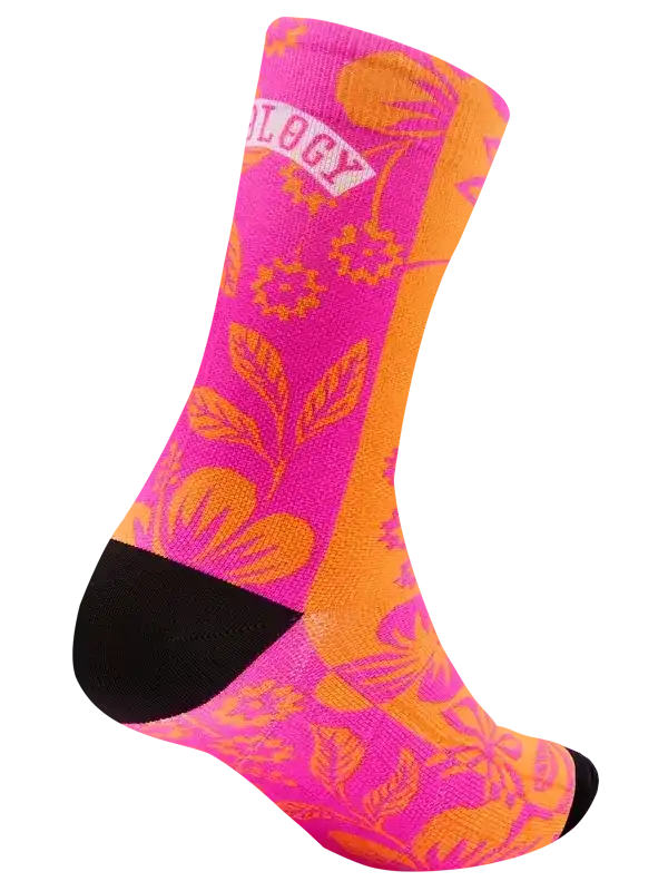 Vibrant pink and orange floral cycling sock with black toe and heel, featuring bold botanical design for bike rides.