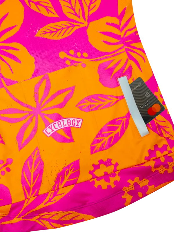 Bright pink and orange fabric with leaf pattern and back pockets