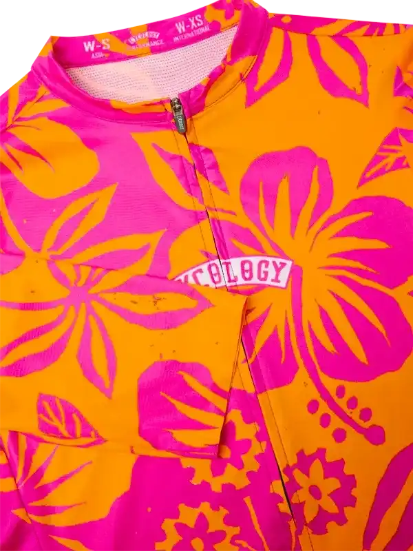 Vibrant orange and pink floral cycling jersey with bold design and zipper detail