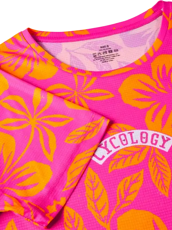 Pink and orange floral cycling jersey with 'Cycology' logo, lightweight performance fabric