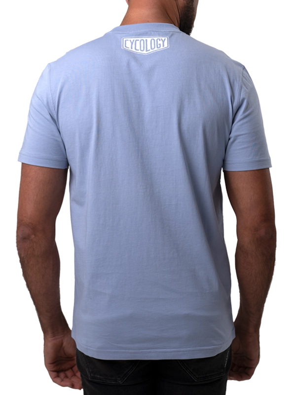 Light blue t-shirt with a Cycology logo on back design worn by a person