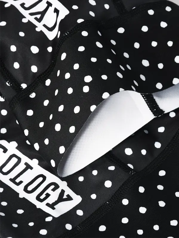 Black cycling bib shorts with white polka dot pattern