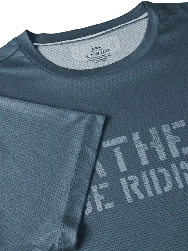 Men's cycling jersey with textured fabric and bold graphic print, ideal for bike rides and athletic performance.