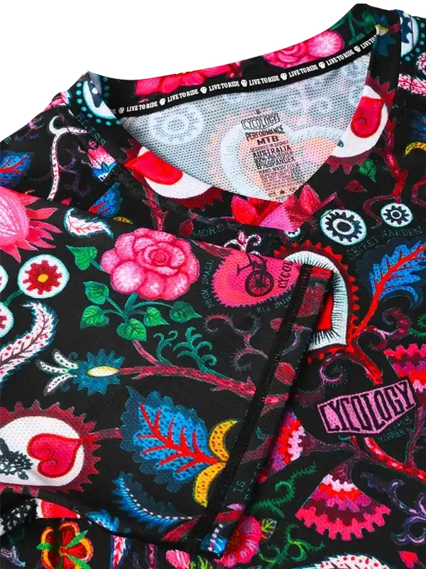 Vibrant floral and gear patterned cycling jersey with bold colors and unique design details