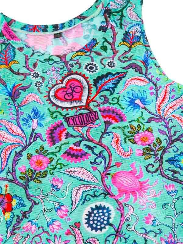 Vibrant floral cycling jersey with heart and bike graphic, colorful botanical print on teal fabric