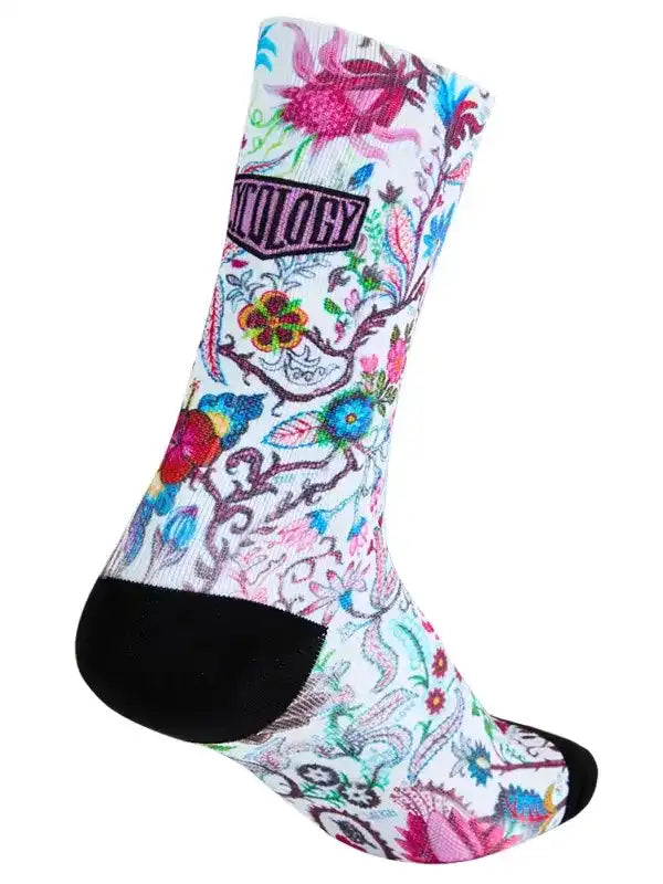 Colorful floral cycling socks with black toe and heel, featuring vibrant patterns for bike rides.