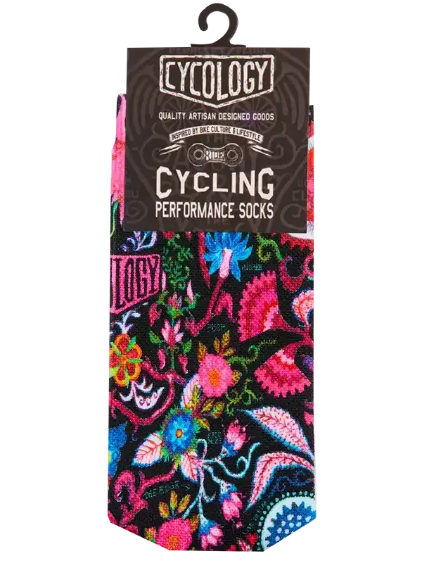 Vibrant floral cycling performance socks with bold pink, blue, and green patterns on black background