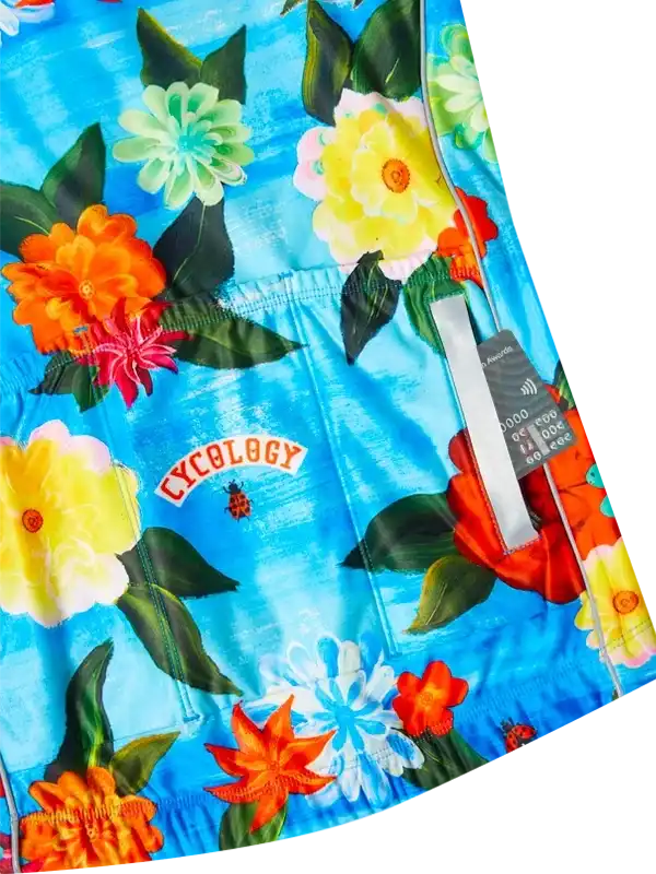 Vibrant floral cycling shorts with bold blue background, perfect for women's or men's bike rides.