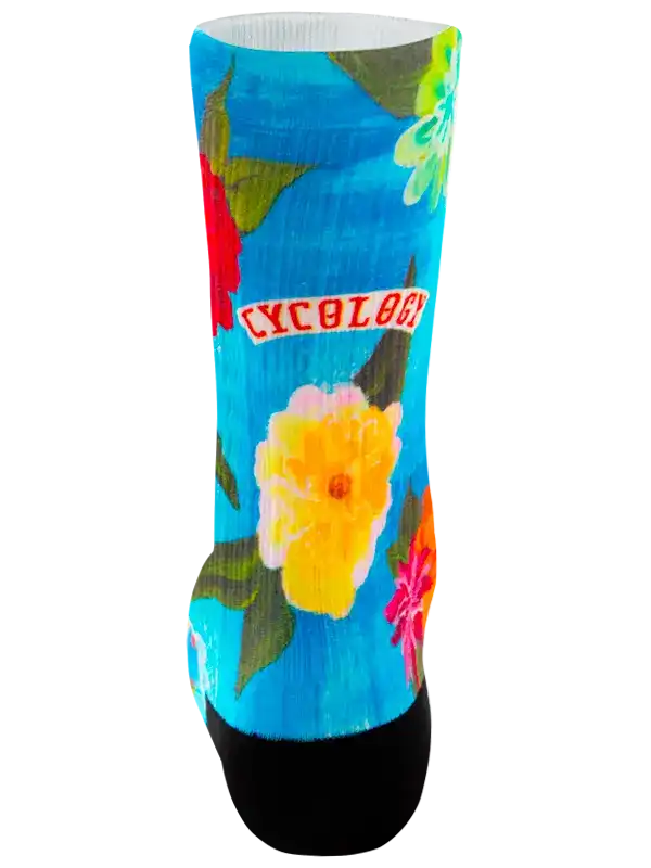 Vibrant floral cycling sock with blue background and bold yellow, pink, red flowers for men and women
