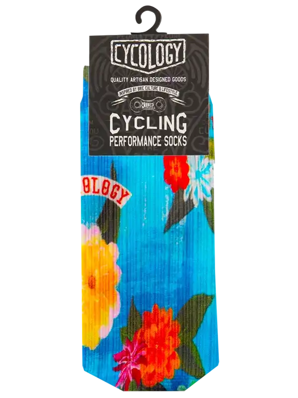 Cycling performance socks with vibrant floral print on blue background, ideal for bike culture and active lifestyle.