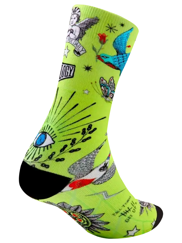 Vibrant neon green cycling socks with tattoo-style designs, including birds, butterflies, and stars.