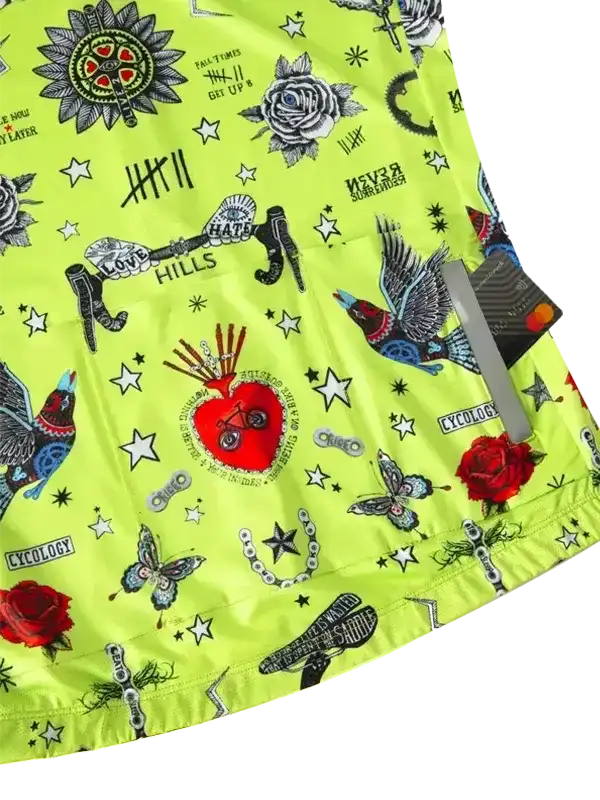 Vibrant neon green cycling jersey with tattoo-style graphics, roses, birds, and stars for men and women riders.