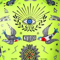 Vibrant neon green cycling jersey with eye, birds, and sunburst tattoo-style graphics
