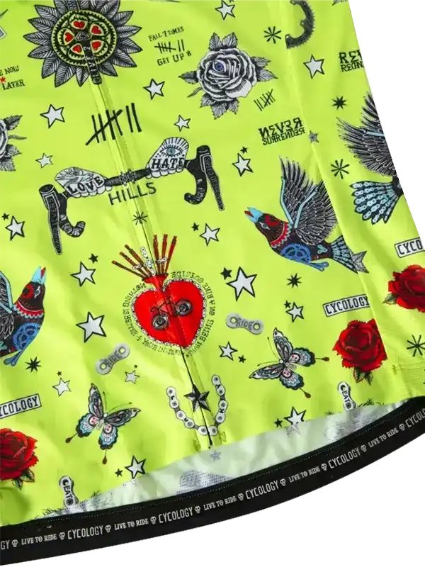 Vibrant lime green cycling jersey with tattoo-style graphics, roses, birds, stars, and bold text designs
