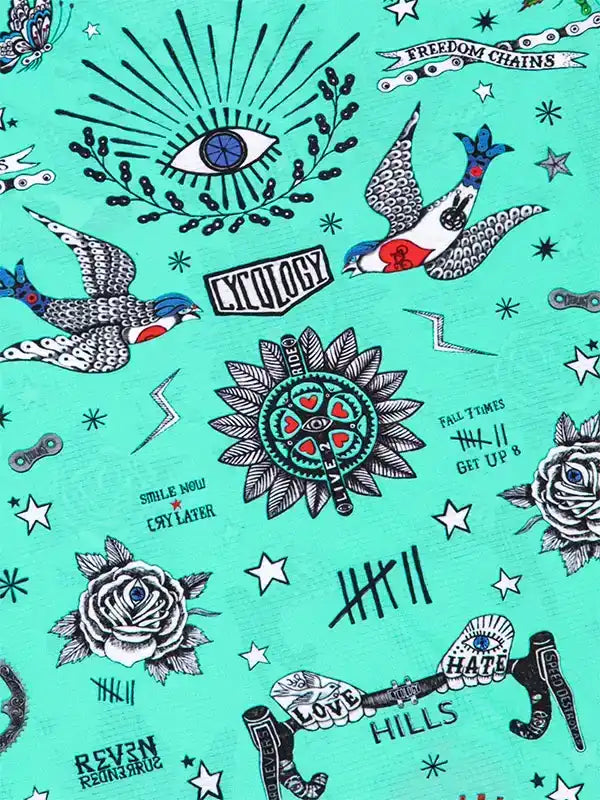 Cycling-themed graphic print with birds, roses, and tattoo-style designs on teal fabric